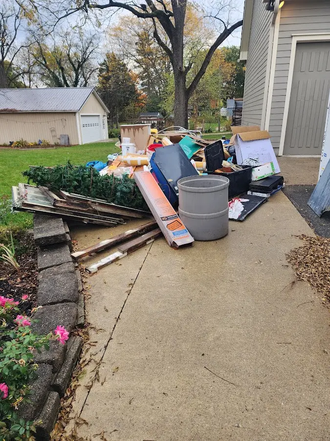 Dumpster being loaded with debris for Residential Dumpster Rental in Gibsonton